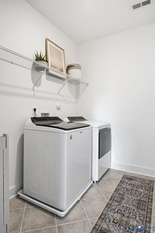 6991 Carden Park Drive, Carden Park, Moseley, VA 23120 Dedicated laundry area featuring a washer and dryer, tile flooring, white walls, white baseboards, and wire shelving