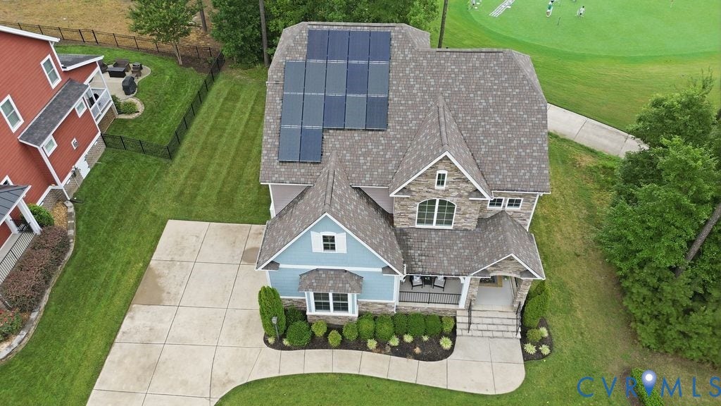 6991 Carden Park Drive, Carden Park, Moseley, VA 23120 Craftsman-style residence featuring a stone and siding exterior, multi-gabled roofline, and integrated solar panels