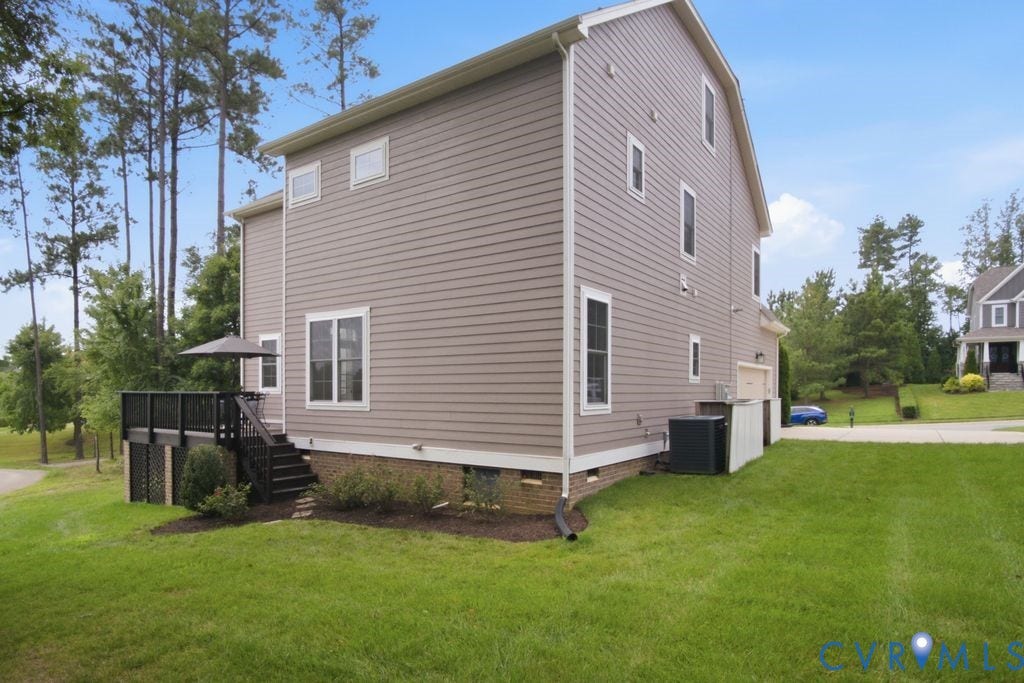 6991 Carden Park Drive, Carden Park, Moseley, VA 23120 Siding exterior with white trim windows and a rear deck