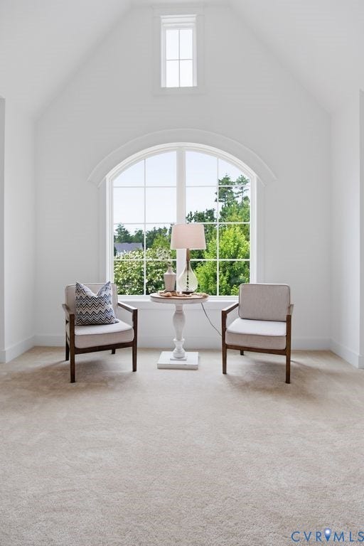 6991 Carden Park Drive, Carden Park, Moseley, VA 23120 Vaulted ceiling featuring an arched window with transom, white trim, and light beige carpet