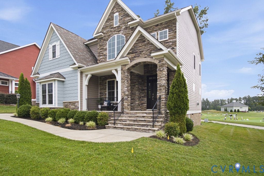 6991 Carden Park Drive, Carden Park, Moseley, VA 23120 Stone and siding exterior featuring a covered front porch with stone columns