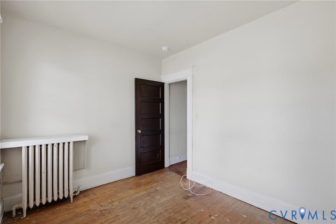 3110 North Avenue, Brookland Park, Richmond, VA 23222 Bright corner bedroom with wood-finish flooring, white walls, and natural light
