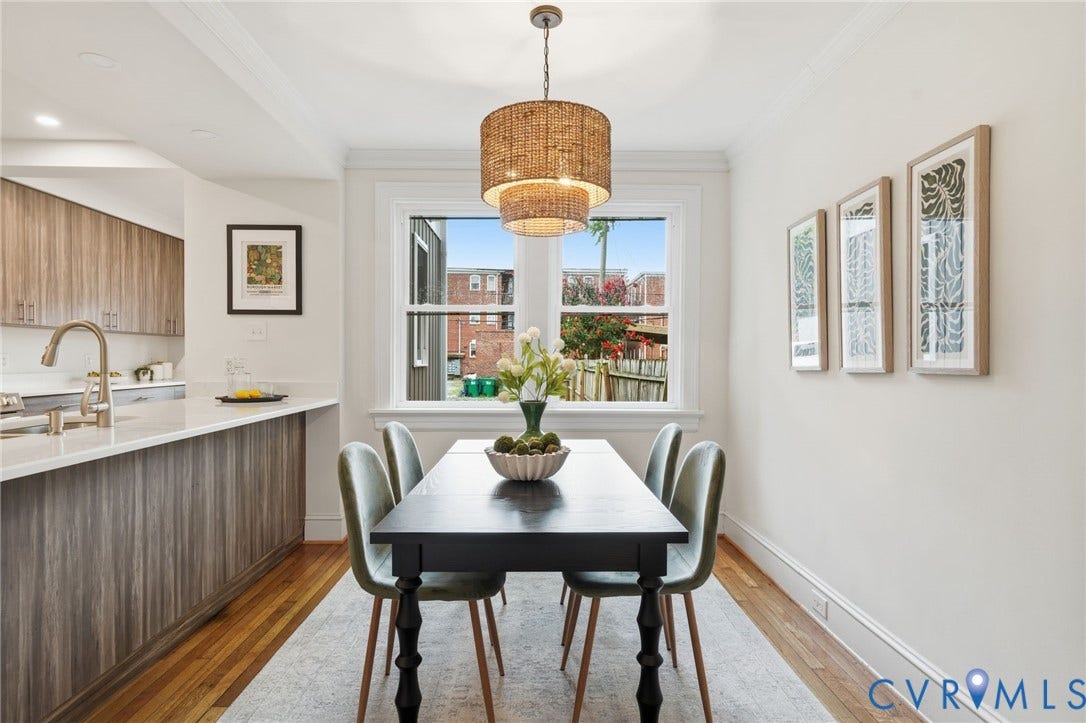 2919 Grayland Avenue, Byrd Park/ Carytown, Richmond, VA 23221 Dining area featuring hardwood flooring, a tiered woven pendant light fixture, crisp white walls, and a large window