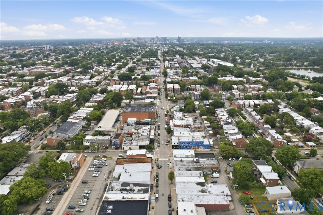 2919 Grayland Avenue, Byrd Park/ Carytown, Richmond, VA 23221 Aerial perspective showcasing a vibrant urban landscape with extensive tree canopy