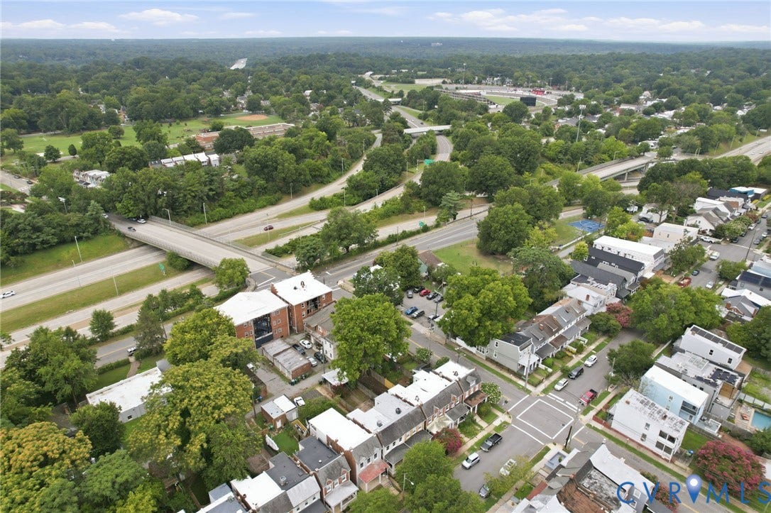2919 Grayland Avenue, Byrd Park/ Carytown, Richmond, VA 23221 Expansive aerial view showcasing residential properties, a significant highway interchange, and abundant mature trees