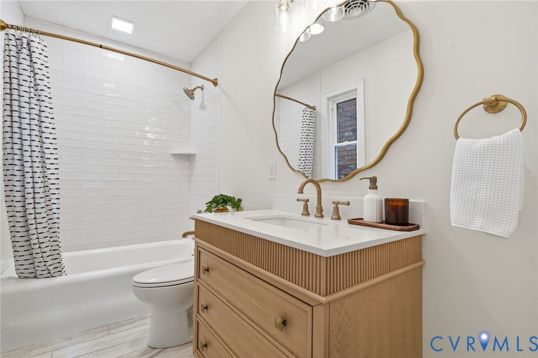2919 Grayland Avenue, Byrd Park/ Carytown, Richmond, VA 23221 Full bathroom on 2nd floor, Modern vanity with fluted wood details, a white countertop, and brushed brass fixtures