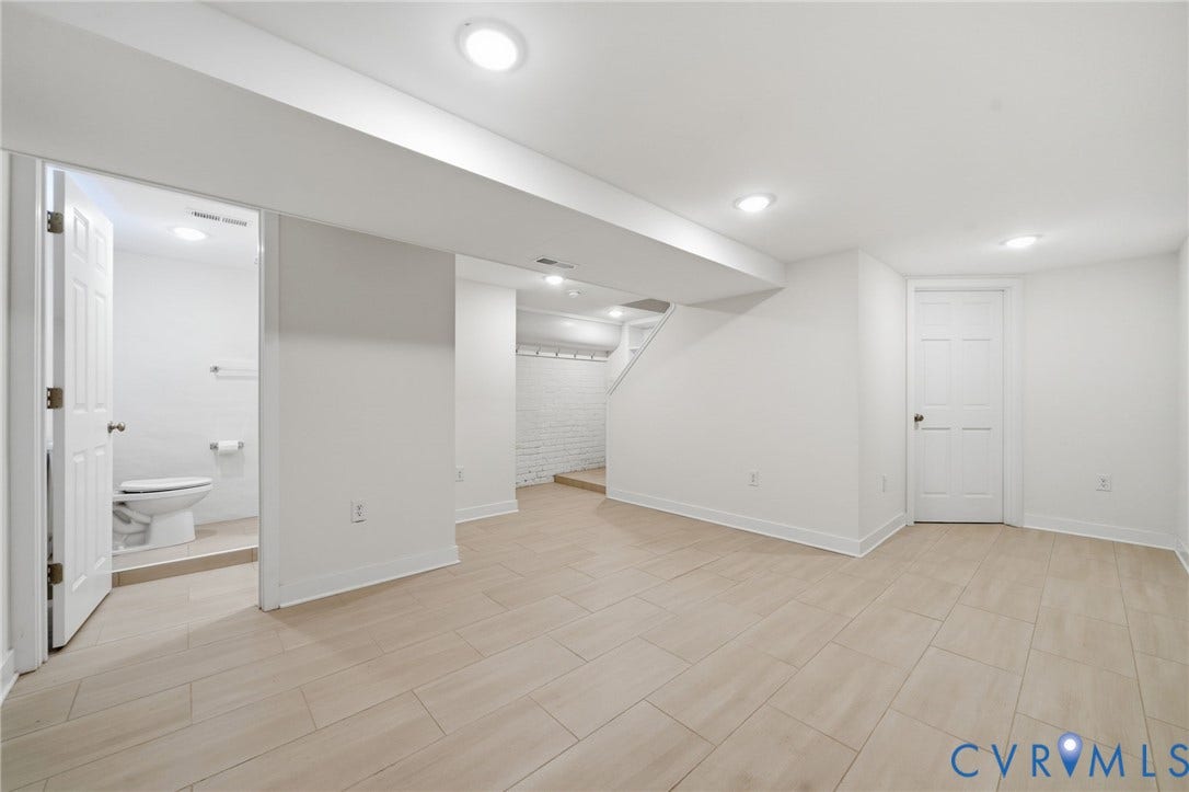 2919 Grayland Avenue, Byrd Park/ Carytown, Richmond, VA 23221 Spacious room featuring light-toned tile flooring, recessed lighting, and a white six-panel door