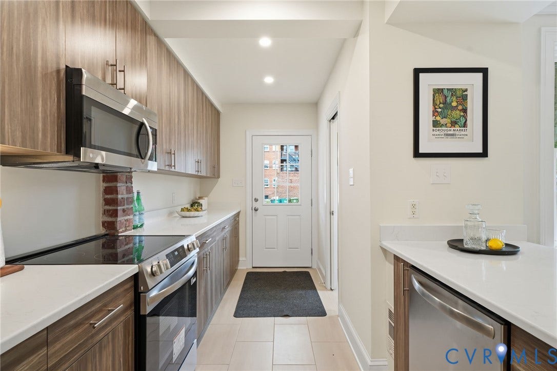 2919 Grayland Avenue, Byrd Park/ Carytown, Richmond, VA 23221 Galley kitchen featuring wood-finish cabinetry, stainless steel appliances, white countertops, and recessed lighting