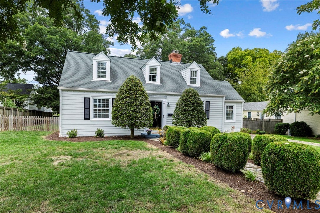 1002 Normandy Drive, Henrico, VA 23229 White siding exterior with a pitched roof and three dormer windows