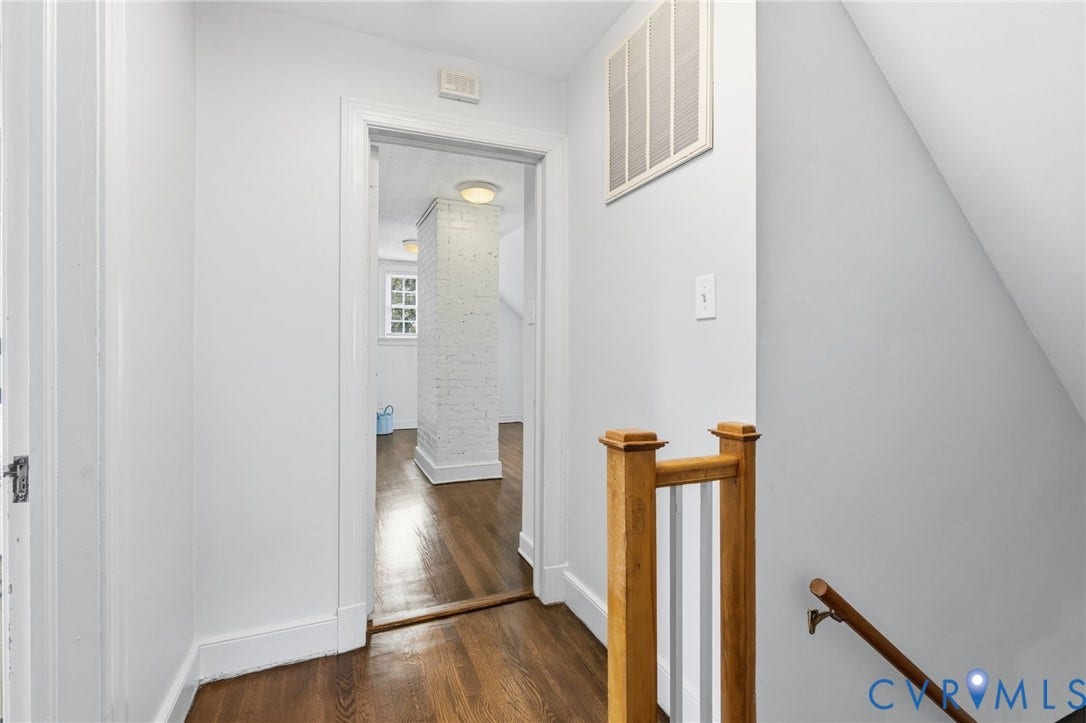 1002 Normandy Drive, Henrico, VA 23229 Hardwood flooring, painted white brick column, recessed lighting, and a wood railing