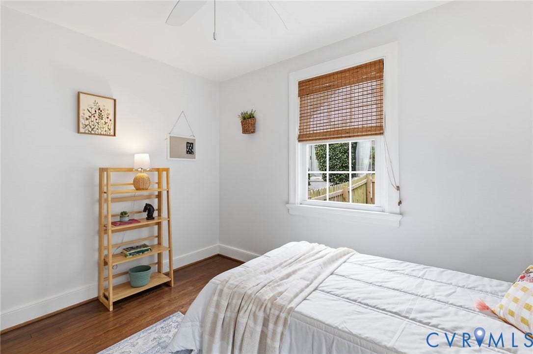 1002 Normandy Drive, Henrico, VA 23229 Hardwood flooring, crisp white walls, white window trim, natural fiber window treatment, and a ceiling fan