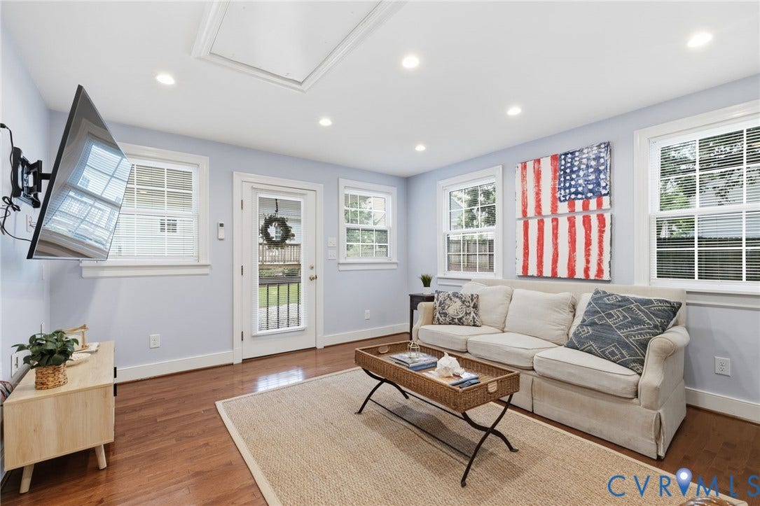 1002 Normandy Drive, Henrico, VA 23229 Wood-finish flooring, recessed lighting, multiple windows with white trim, and a glass-paneled door