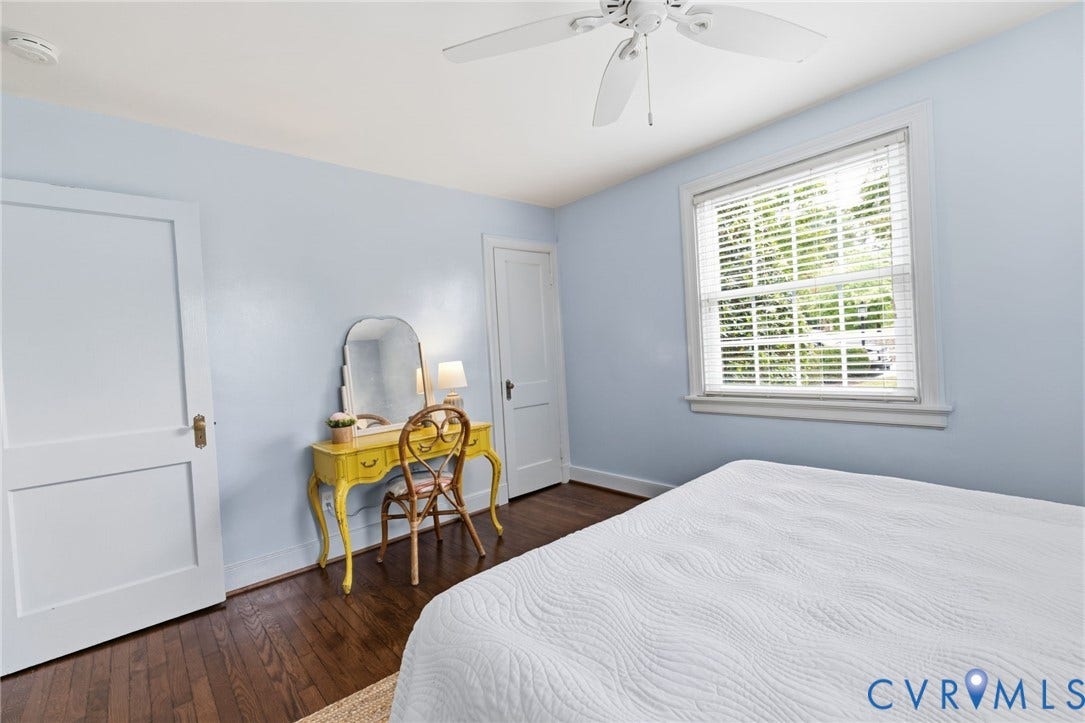 1002 Normandy Drive, Henrico, VA 23229 Hardwood flooring, painted walls, two-panel interior doors, and a ceiling fan with integrated lighting