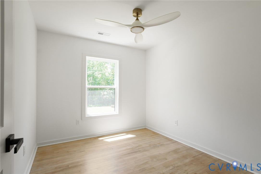 3056 Davis Mill Road, Goochland, VA 23063 Bright room featuring wood-finish flooring, white walls, a single window, and a ceiling fan with integrated lighting
