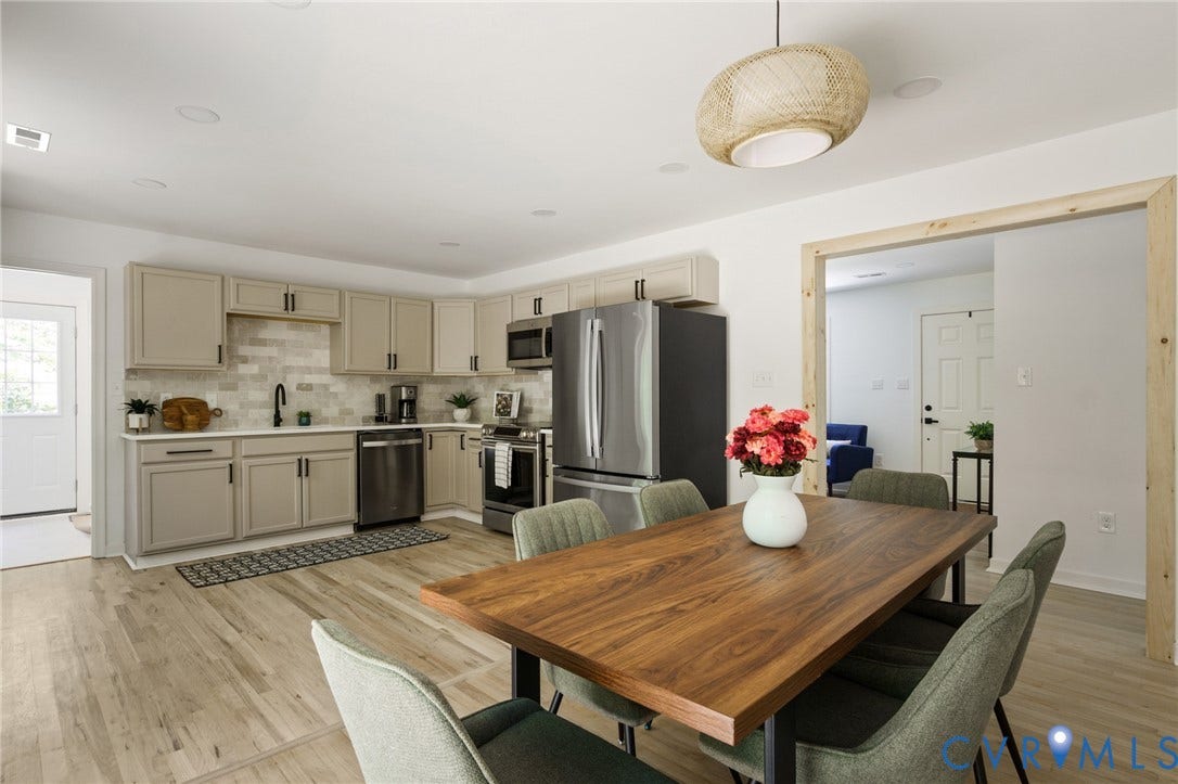 3056 Davis Mill Road, Goochland, VA 23063 Open-concept kitchen and dining area featuring light wood-finish flooring, recessed lighting, and a modern woven pendant light