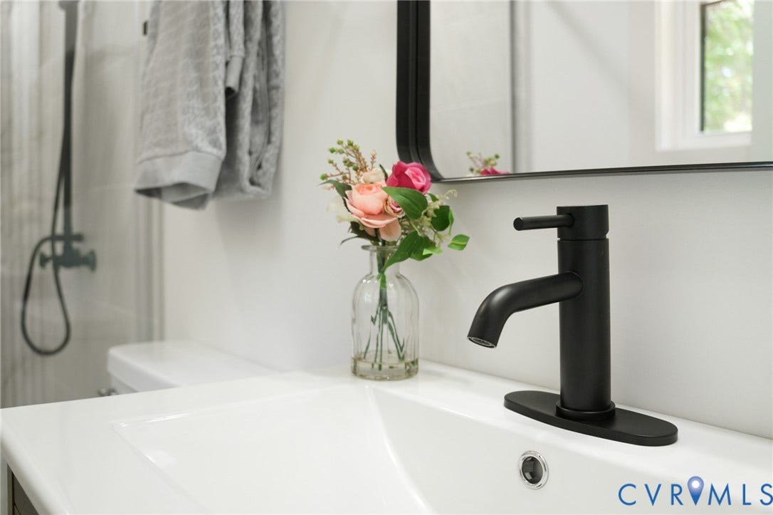 3056 Davis Mill Road, Goochland, VA 23063 White ceramic sink basin with a matte black single-handle faucet