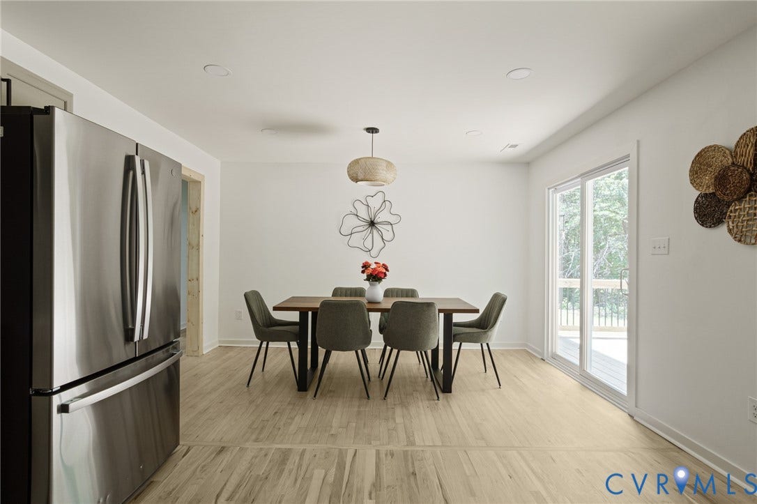 3056 Davis Mill Road, Goochland, VA 23063 Dining area featuring light wood-finish flooring and a contemporary pendant light fixture