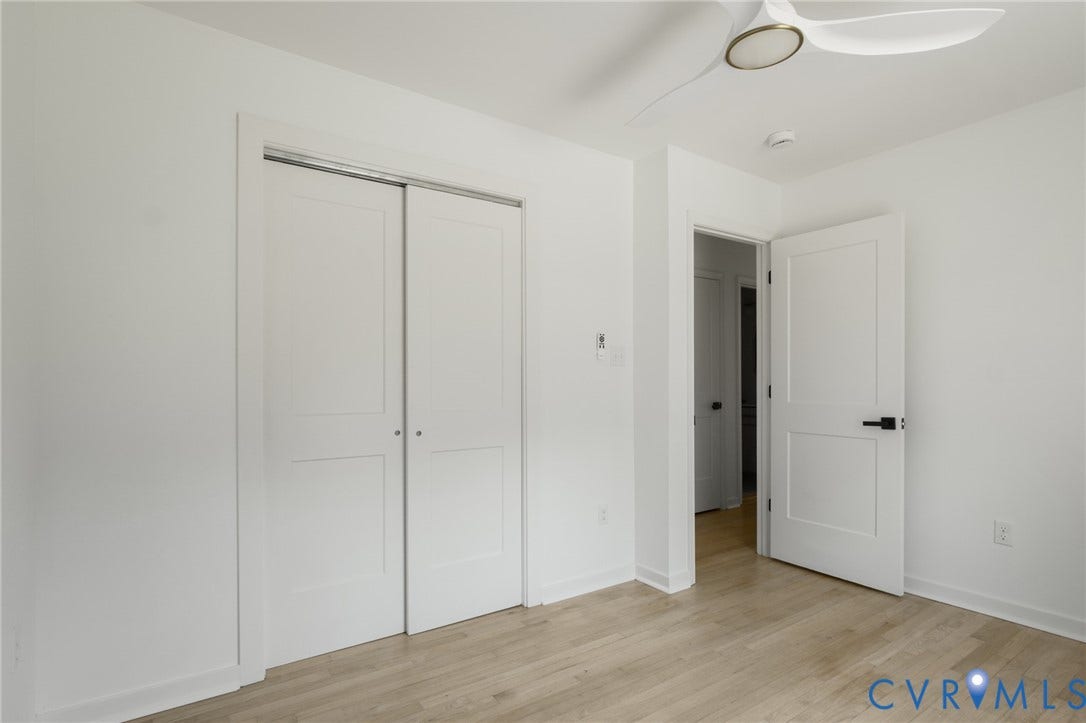 3056 Davis Mill Road, Goochland, VA 23063 Bedroom featuring light wood-finish flooring, white walls, and white baseboards