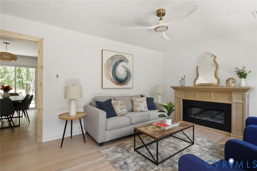 3056 Davis Mill Road, Goochland, VA 23063 Living area with light wood-finish flooring and a central ceiling fan
