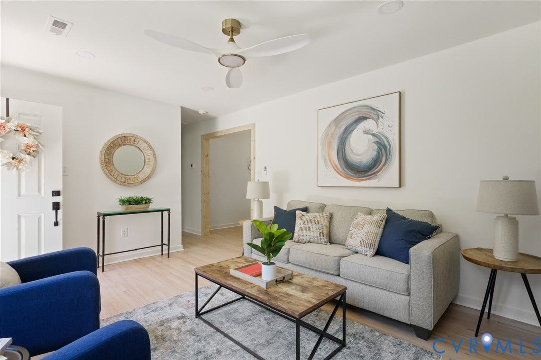 3056 Davis Mill Road, Goochland, VA 23063 Bright living area with light wood-finish flooring, recessed ceiling lights, and a modern ceiling fan