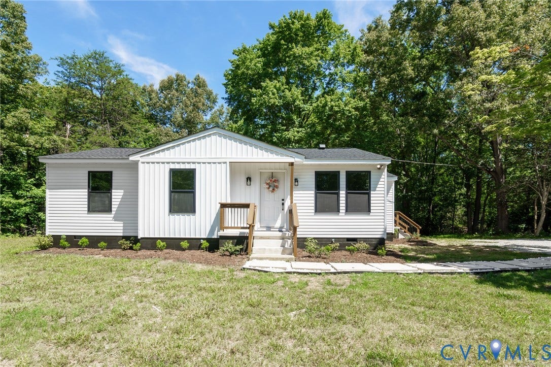 3056 Davis Mill Road, Goochland, VA 23063 White siding exterior with a dark shingle roof, featuring dark-framed windows