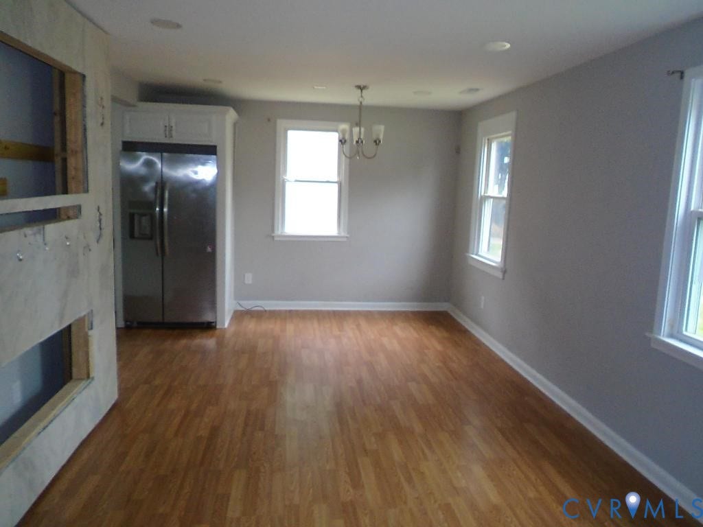 3406 Mike Road, Richmond, VA 23234 Open-concept room featuring wood-finish flooring, light gray walls, and recessed lighting