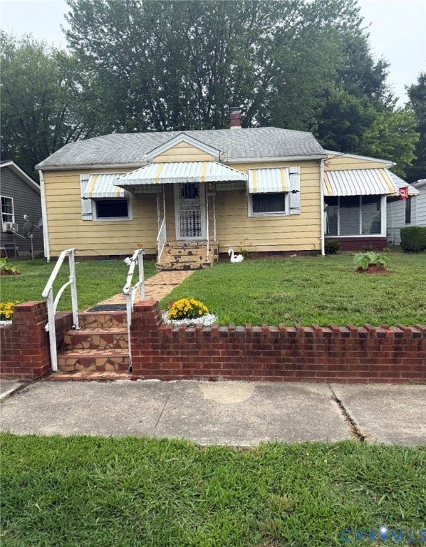 1608 N 25th Street, Churchill, Richmond, VA 23223 Single-story residence featuring yellow siding and a gray shingle roof