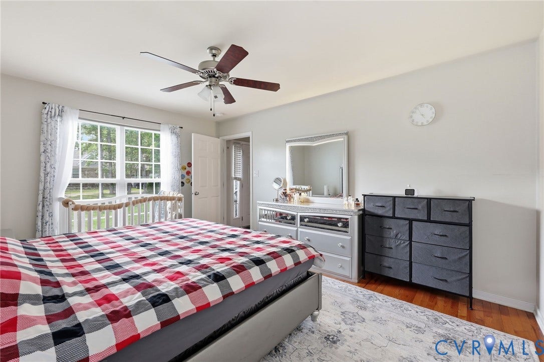 10155 Virginia Road, Glen Allen, VA 23060 Bright room featuring hardwood-finish flooring and a ceiling fan with light fixture