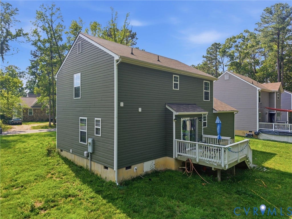 10155 Virginia Road, Glen Allen, VA 23060 Rear exterior featuring a spacious wood deck, sliding glass door access, and olive green siding