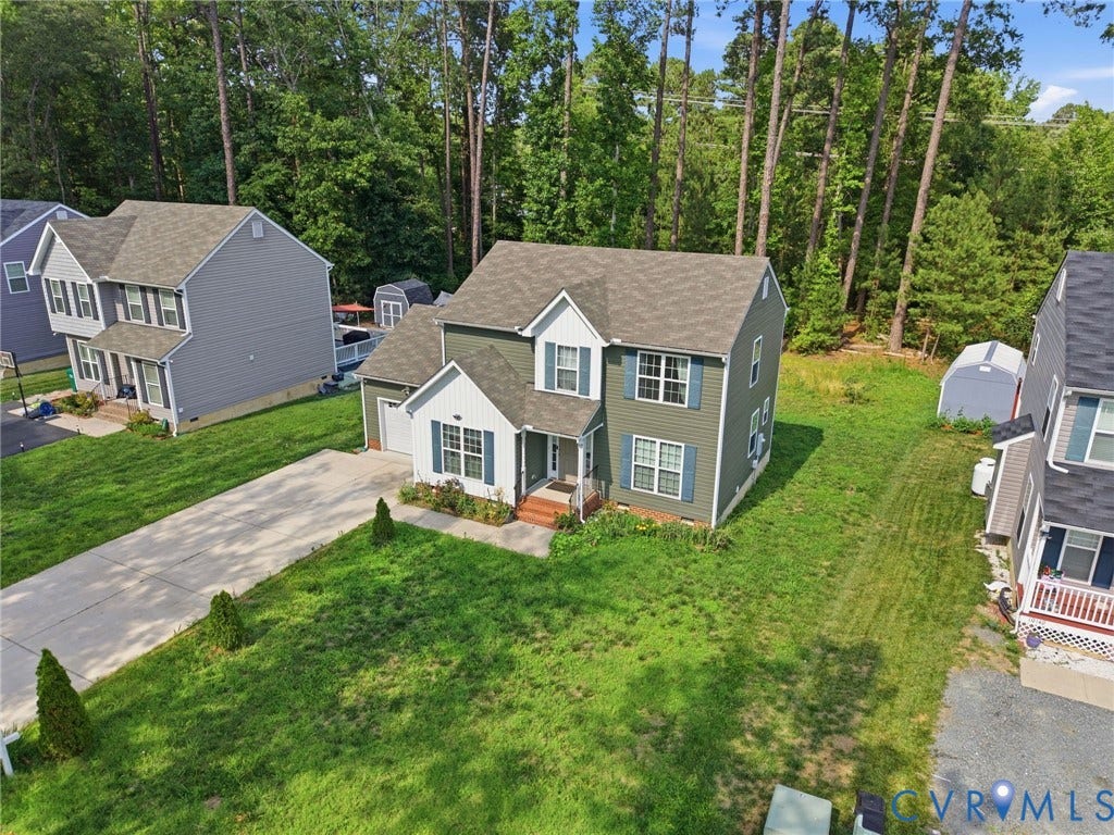 10155 Virginia Road, Glen Allen, VA 23060 Two-story residence with a gabled roof and dormer windows