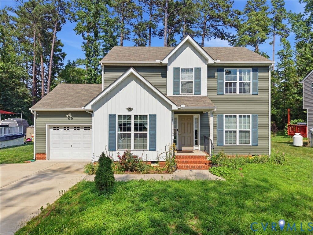 10155 Virginia Road, Glen Allen, VA 23060 Two-story residence featuring siding exterior, a prominent front gable, and an attached garage with a white panel door