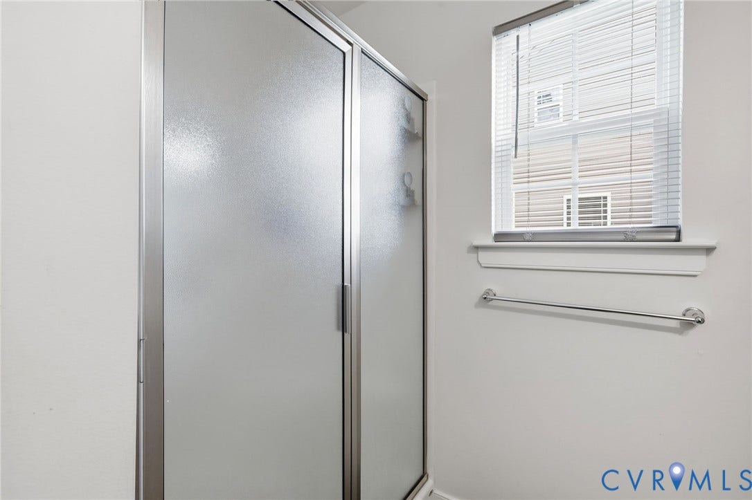 10155 Virginia Road, Glen Allen, VA 23060 Frosted glass shower enclosure with chrome framing and hardware
