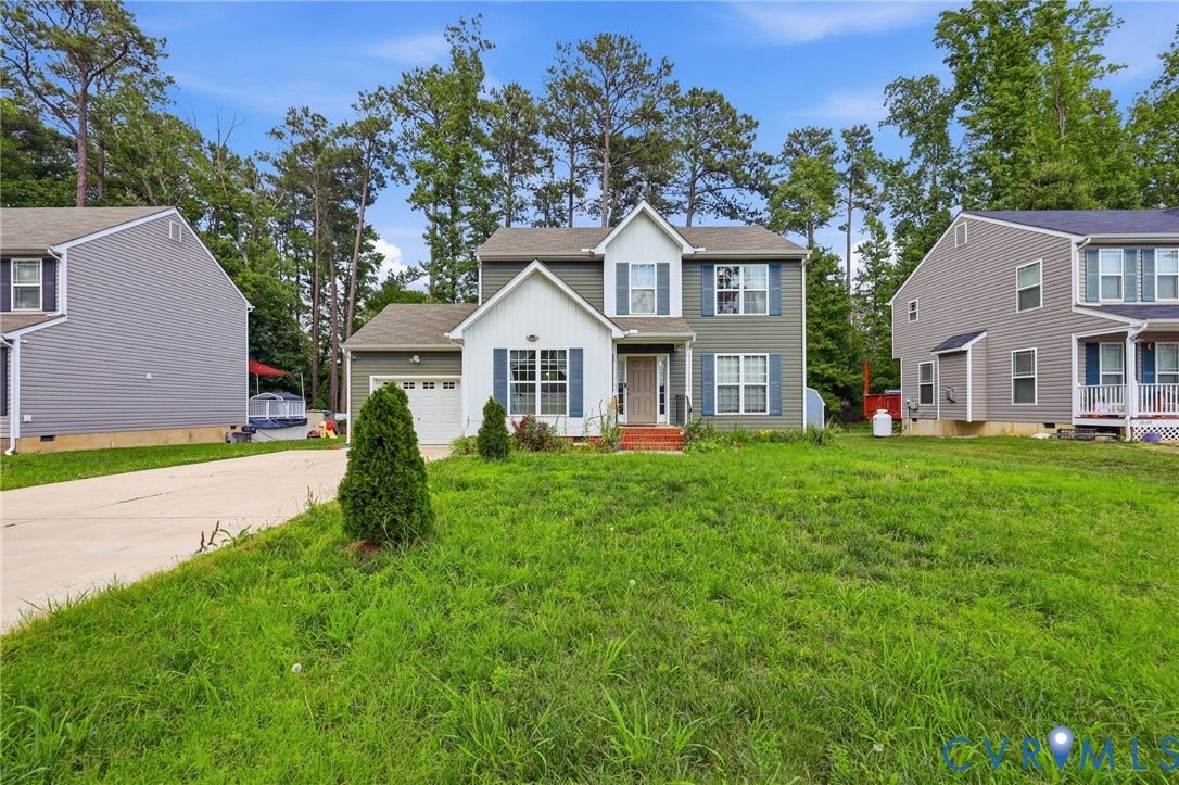 10155 Virginia Road, Glen Allen, VA 23060 Two-story residence featuring a combination of siding and white gables, a single-car garage, and blue window shutters