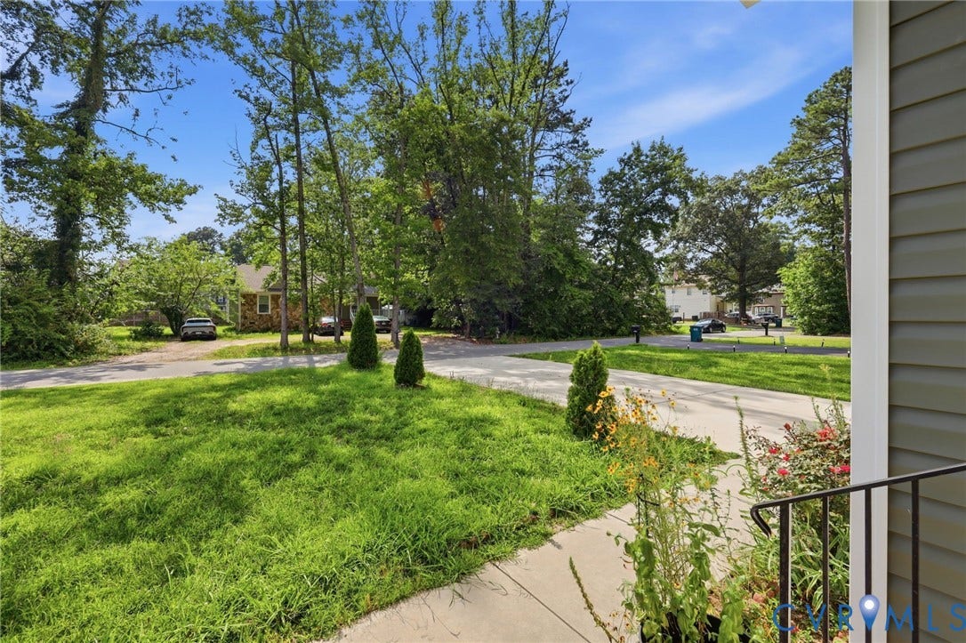 10155 Virginia Road, Glen Allen, VA 23060 Front yard with a concrete driveway and mature perimeter trees