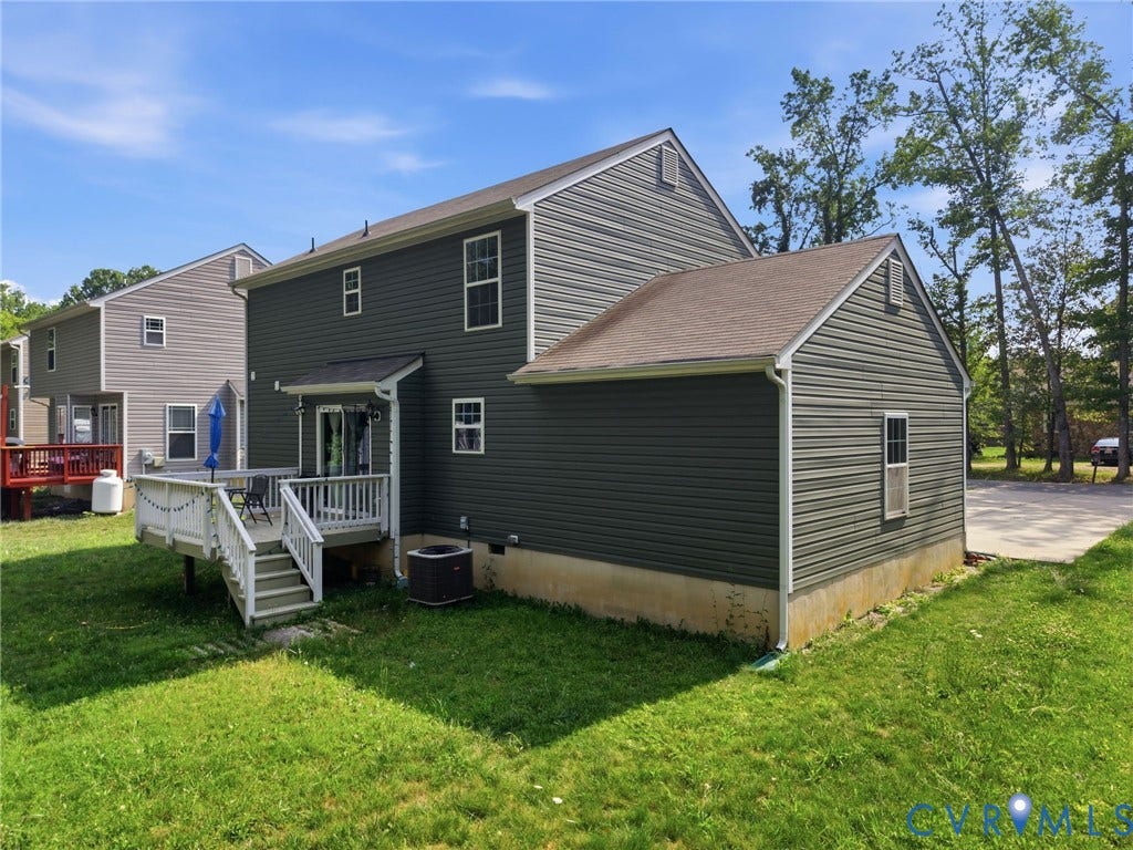 10155 Virginia Road, Glen Allen, VA 23060 Rear exterior featuring dark gray siding, white trim, and a multi-level deck with white railings