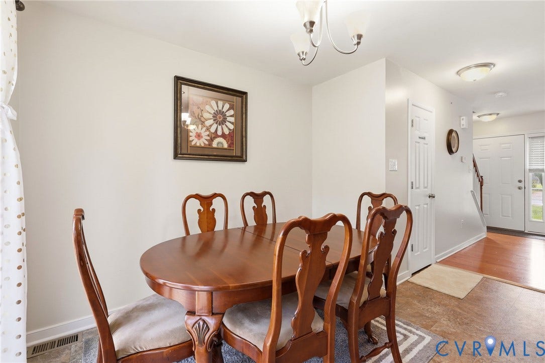 10155 Virginia Road, Glen Allen, VA 23060 Dining area featuring a contemporary chandelier, white walls, and a durable flooring surface