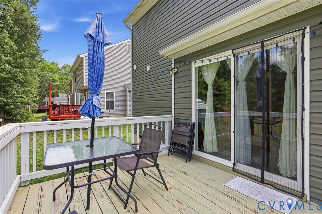 10155 Virginia Road, Glen Allen, VA 23060 Spacious wood-finish deck featuring white railings and a sliding glass door