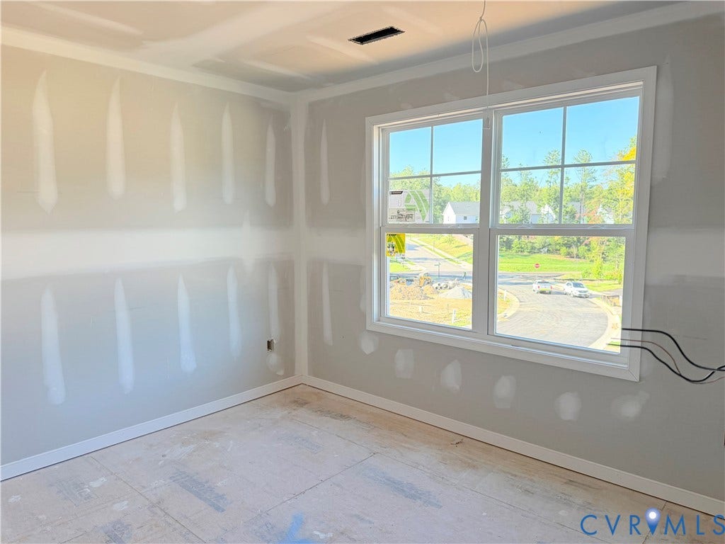 11130 Somerset Bluff Court, Somerset Hills, Glen Allen, VA 23059 Large window with grilles, white window trim, white crown molding, white baseboards, and neutral wall surfaces