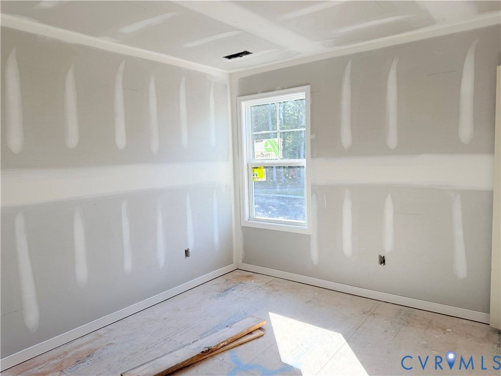 11130 Somerset Bluff Court, Somerset Hills, Glen Allen, VA 23059 Room featuring drywall installation, crown molding, and a single-pane window