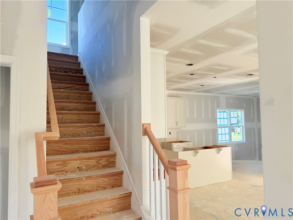 11130 Somerset Bluff Court, Somerset Hills, Glen Allen, VA 23059 Hardwood staircase with natural wood-finish banister, recessed lighting, and built-in cabinetry