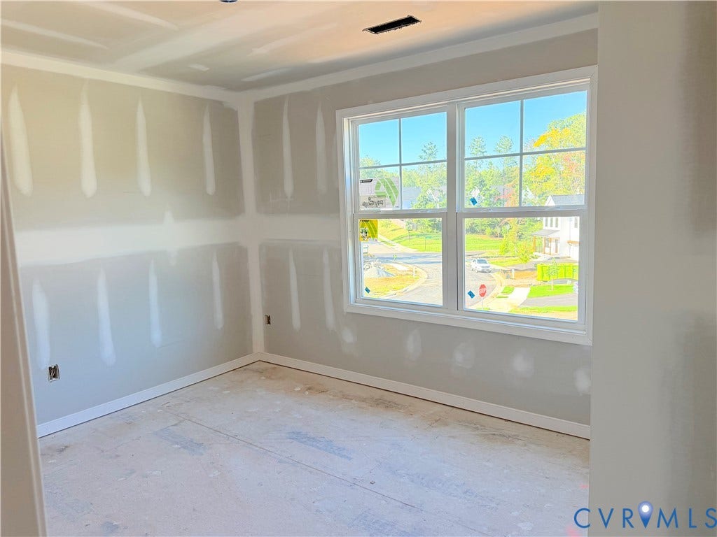 11130 Somerset Bluff Court, Somerset Hills, Glen Allen, VA 23059 New construction interior featuring a large multi-pane window, crown molding, and baseboard trim
