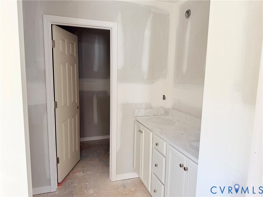 11130 Somerset Bluff Court, Somerset Hills, Glen Allen, VA 23059 White shaker style cabinetry with brushed nickel hardware, light-toned countertop, and matching backsplash
