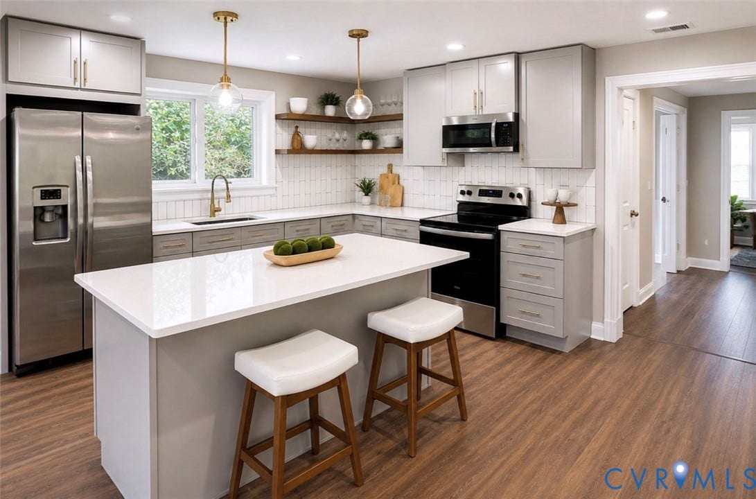 3909 Corbin Street, Wahington Park, Richmond, VA 23222 Kitchen featuring an expansive center island with seating, white countertops, wood-finish flooring, stainless steel appliances, and open shelving