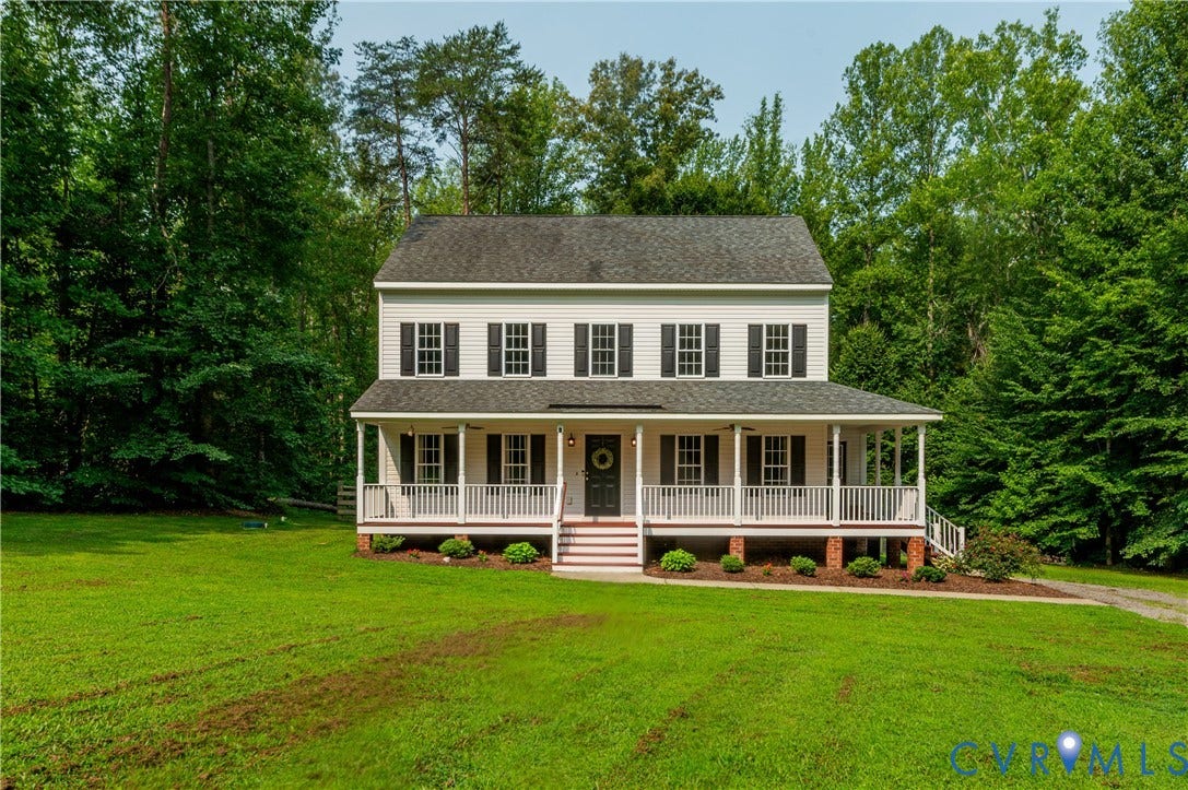 384 Tillar Lane, Mineral, VA 23117 Two-story colonial residence featuring a welcoming full-width covered porch with white railing