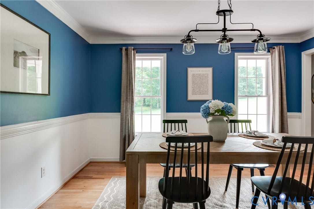 384 Tillar Lane, Mineral, VA 23117 Dining area featuring a wood-finish table, hardwood flooring, and a modern chandelier