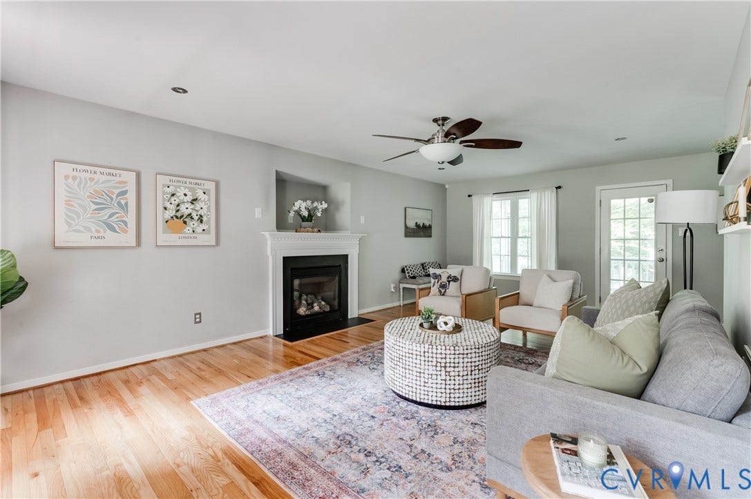 384 Tillar Lane, Mineral, VA 23117 Living space featuring hardwood flooring, a fireplace with a white mantel, ceiling fan with light fixture, recessed lighting, and a glass-paned door