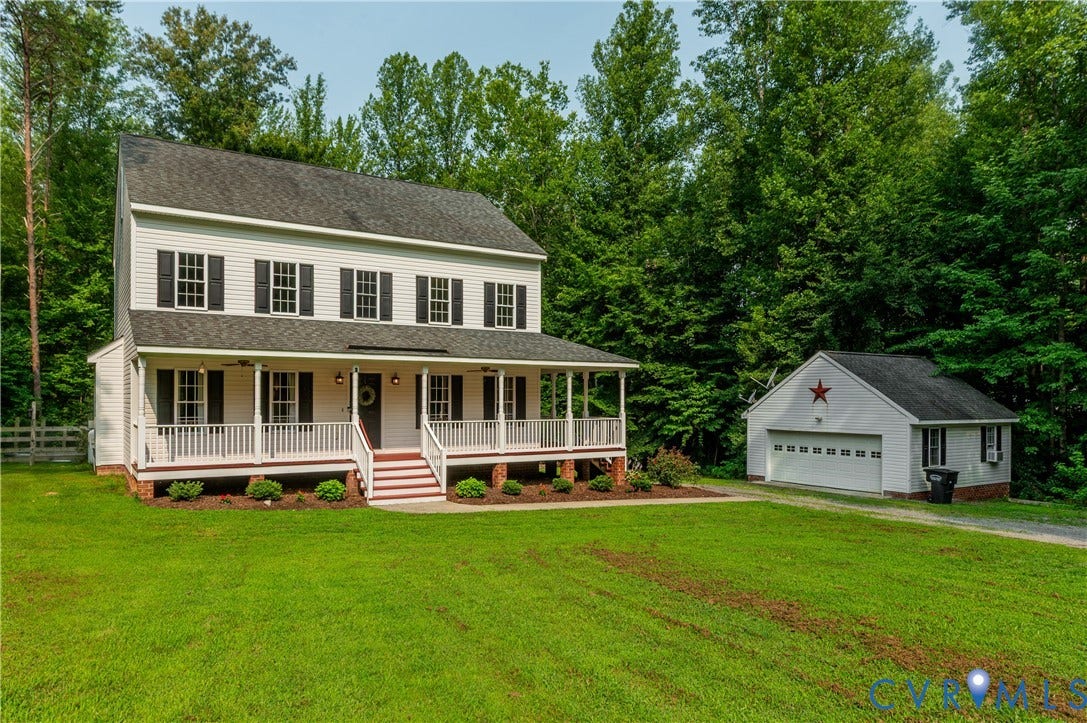 384 Tillar Lane, Mineral, VA 23117 Two-story residence featuring a full-width front porch with white railings and columns