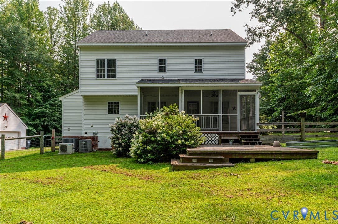 384 Tillar Lane, Mineral, VA 23117 Expansive green lawn with a two-story white siding exterior