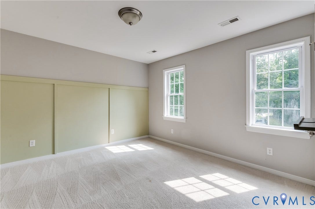 384 Tillar Lane, Mineral, VA 23117 Light gray painted walls complementing a sage green accent wall with panel detailing