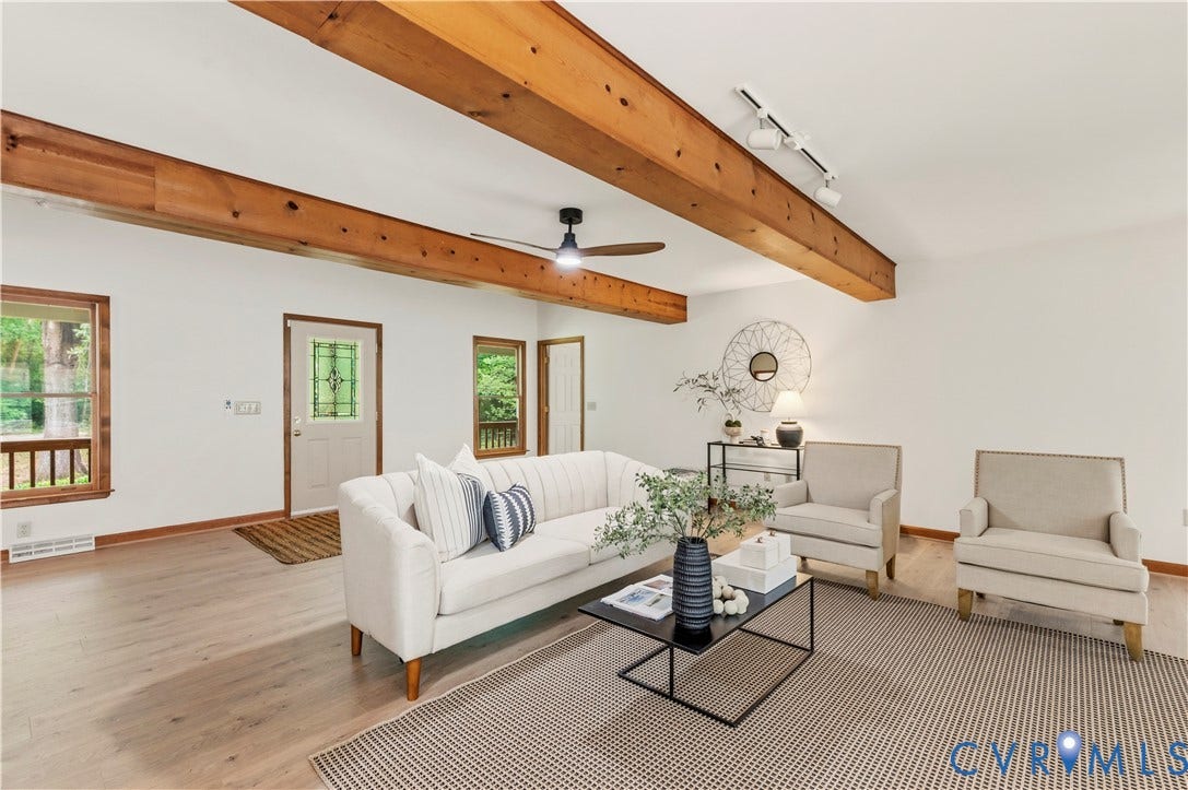 4415 Spoonbill Drive, Powhatan, VA 23139 Vaulted ceiling with exposed wood beams, wood-finish flooring, and track lighting